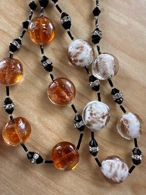 Amber and white Swirl Glass Bead Necklace with Black beads and crystal accents